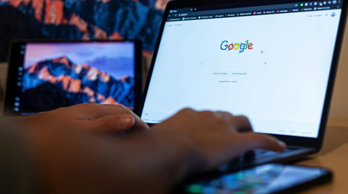 person typing on google home page